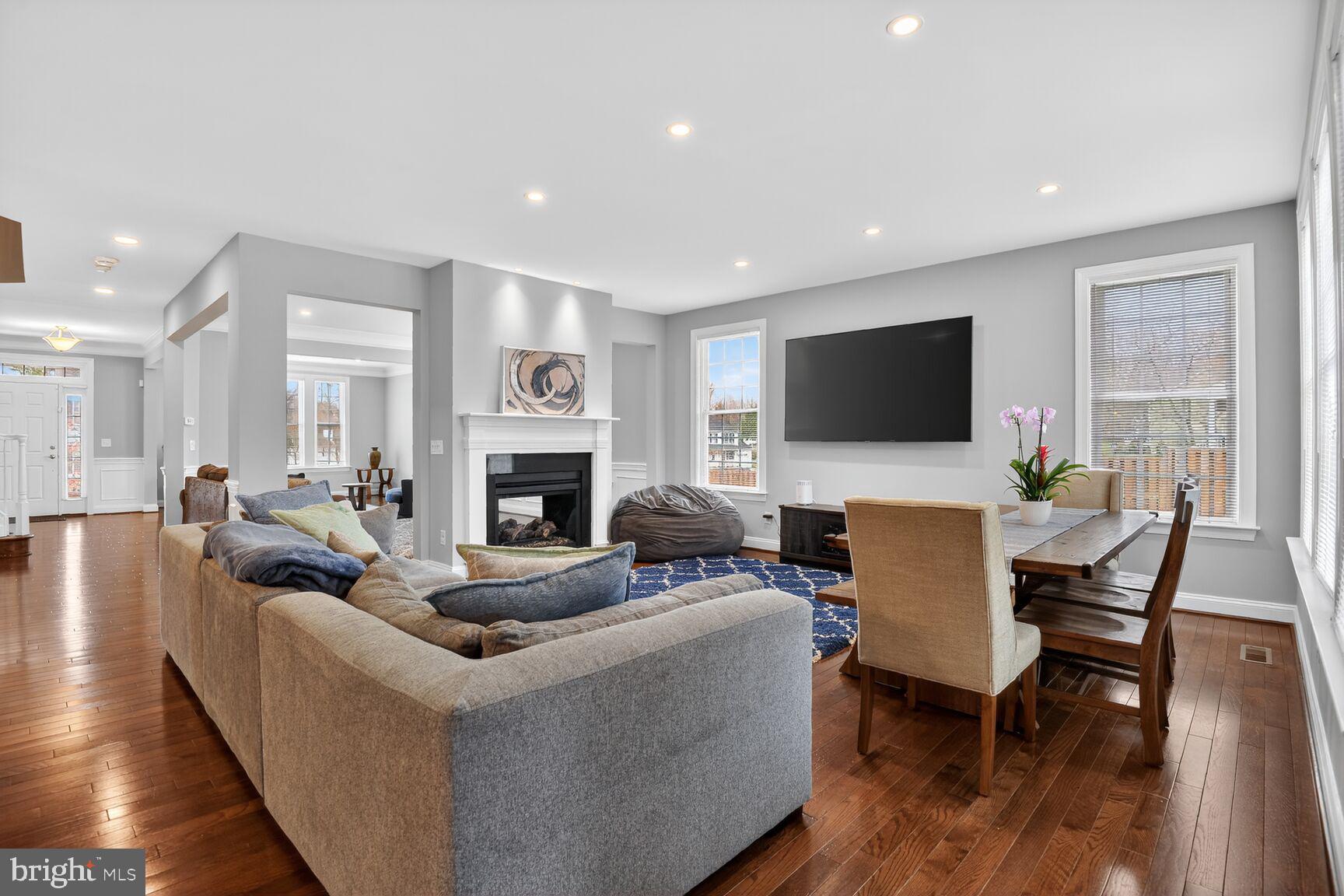 8808 Talbert Road Lorton, VA 22079 - Photo 15 of 52 a living room with fireplace furniture and a flat screen tv