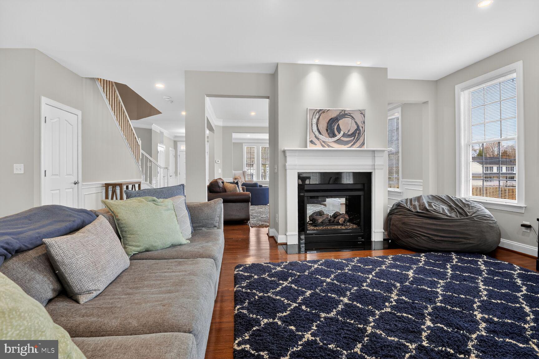 8808 Talbert Road Lorton, VA 22079 - Photo 17 of 52 a living room with furniture and a fireplace