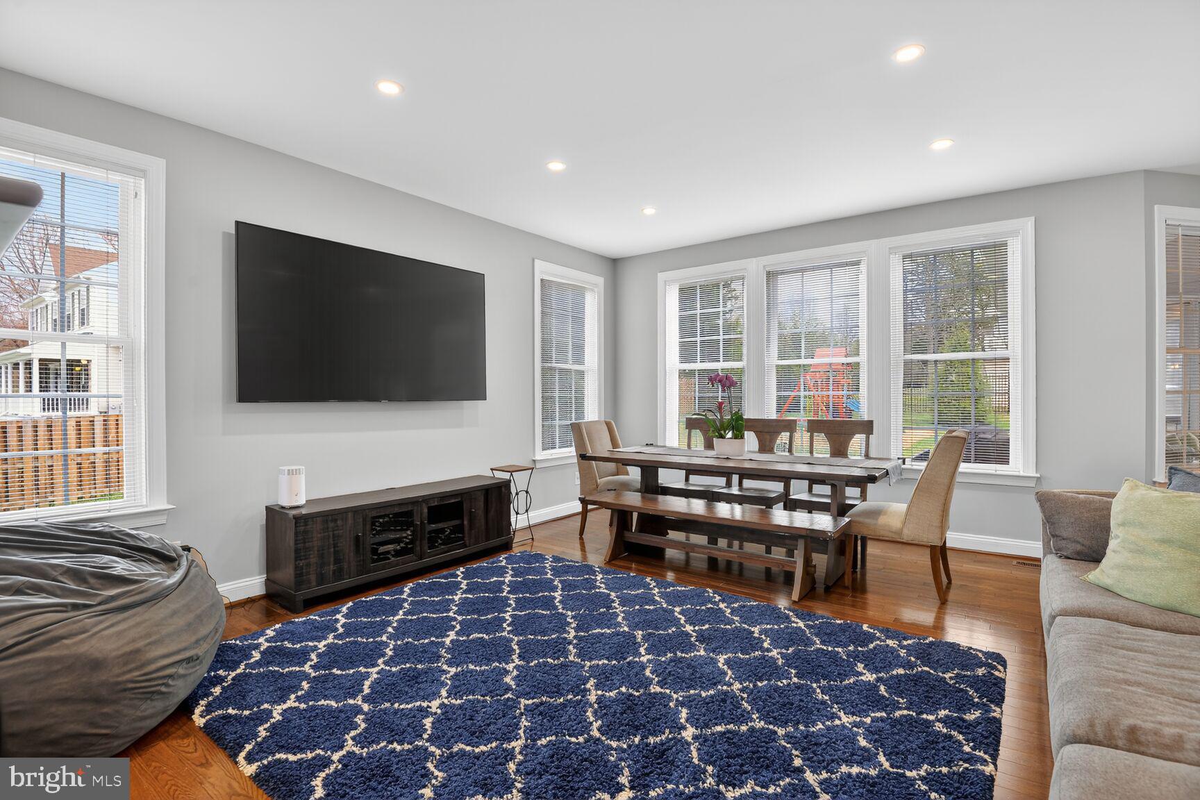 8808 Talbert Road Lorton, VA 22079 - Photo 18 of 52 a living room with a flat screen tv and a rug