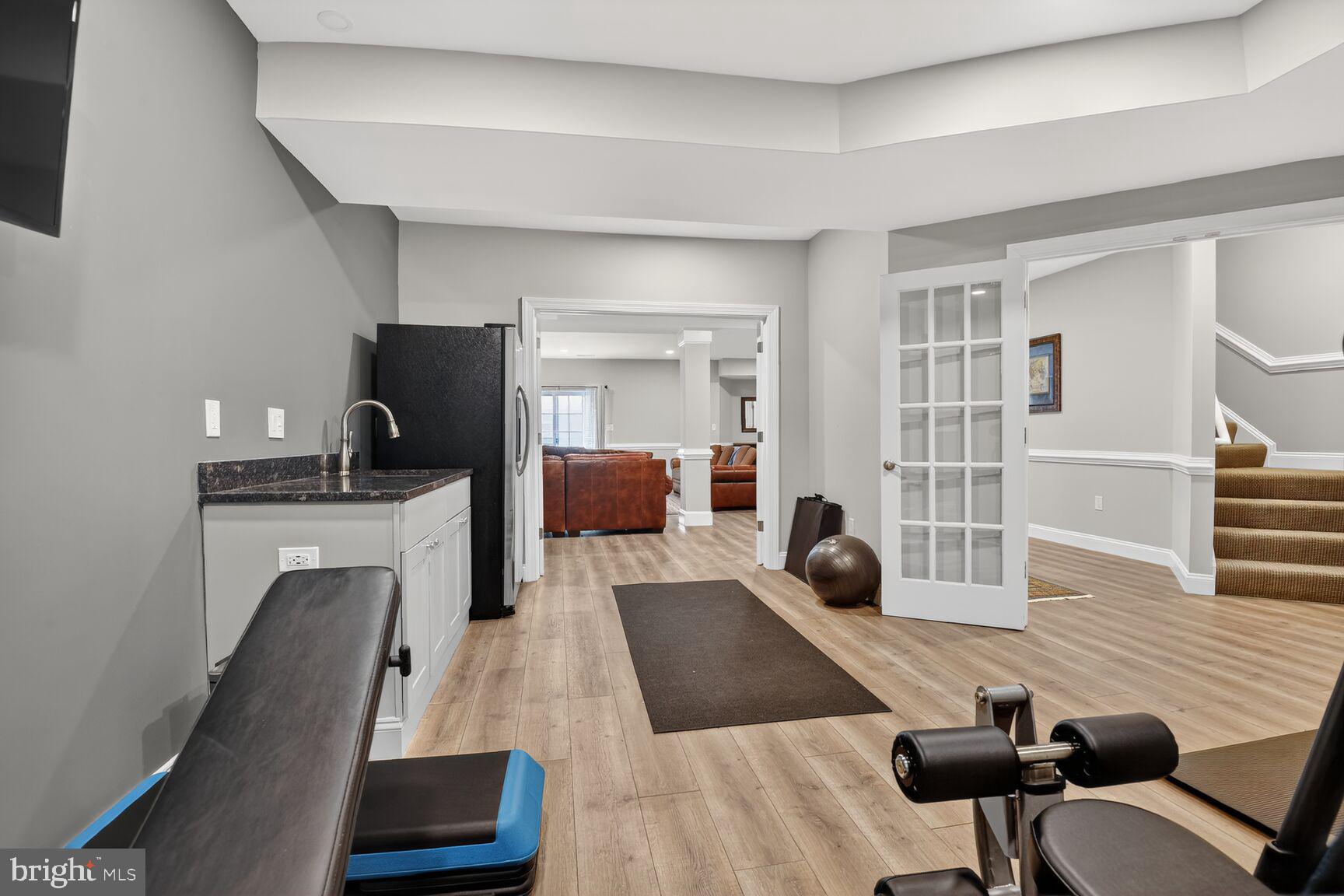 8808 Talbert Road Lorton, VA 22079 - Photo 36 of 52 a room with furniture and a flat screen tv