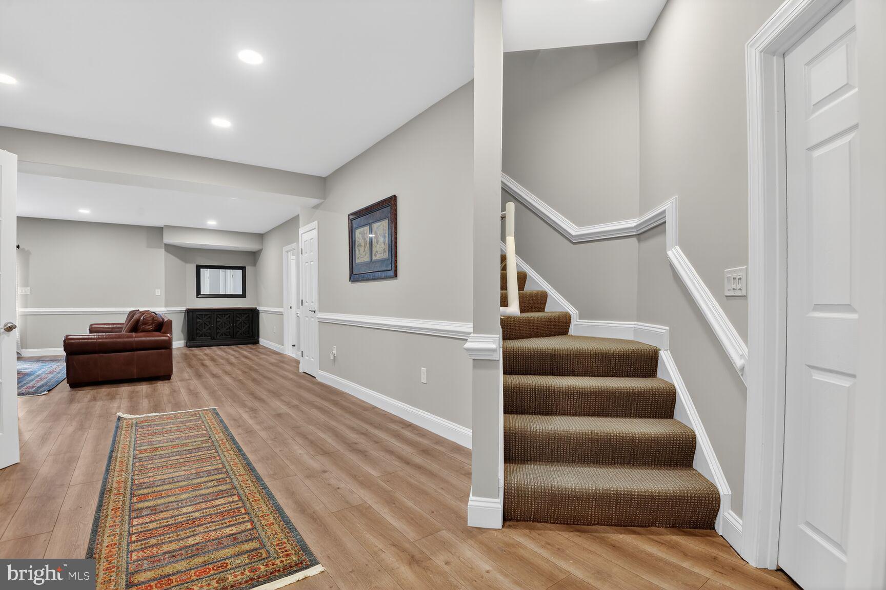 8808 Talbert Road Lorton, VA 22079 - Photo 38 of 52 a living room with furniture and a rug