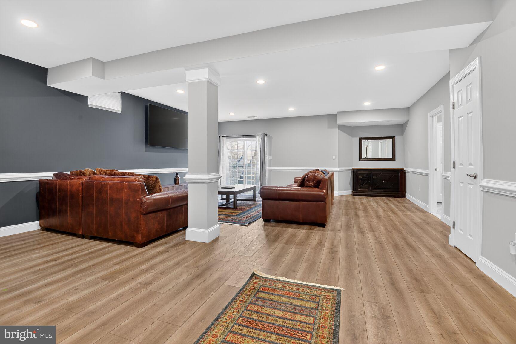 8808 Talbert Road Lorton, VA 22079 - Photo 39 of 52 a living room with furniture and a flat screen tv