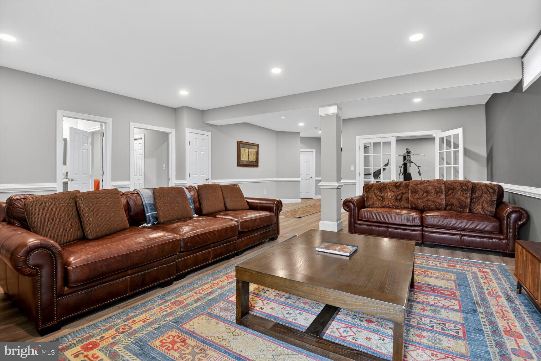 8808 Talbert Road Lorton, VA 22079 - Photo 40 of 52 a living room with furniture and a rug