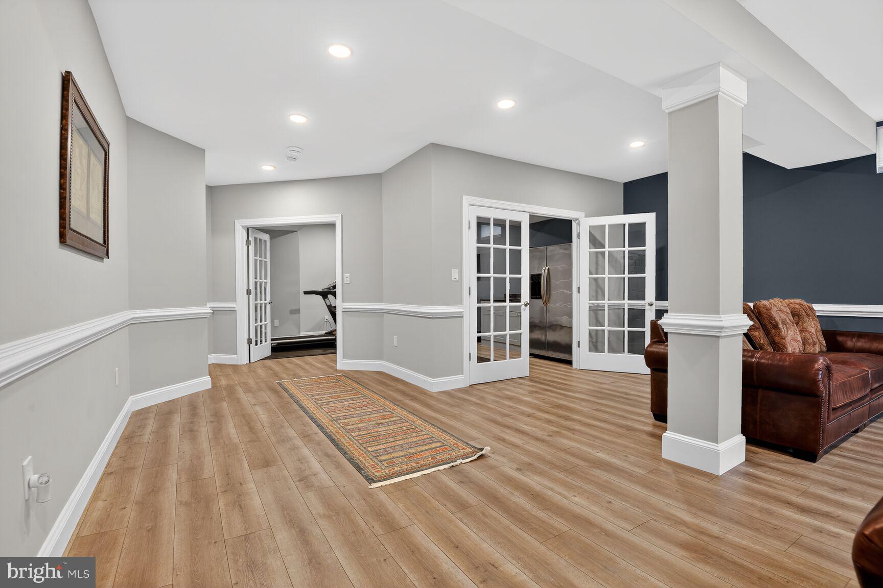 8808 Talbert Road Lorton, VA 22079 - Photo 42 of 52 a spacious bedroom with a bed and wooden floor