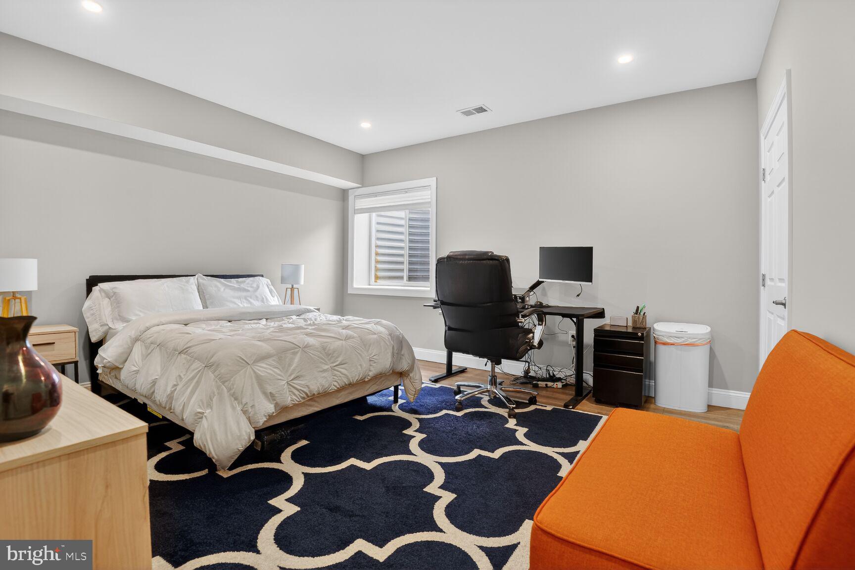 8808 Talbert Road Lorton, VA 22079 - Photo 43 of 52 a bedroom with a bed and wooden floor