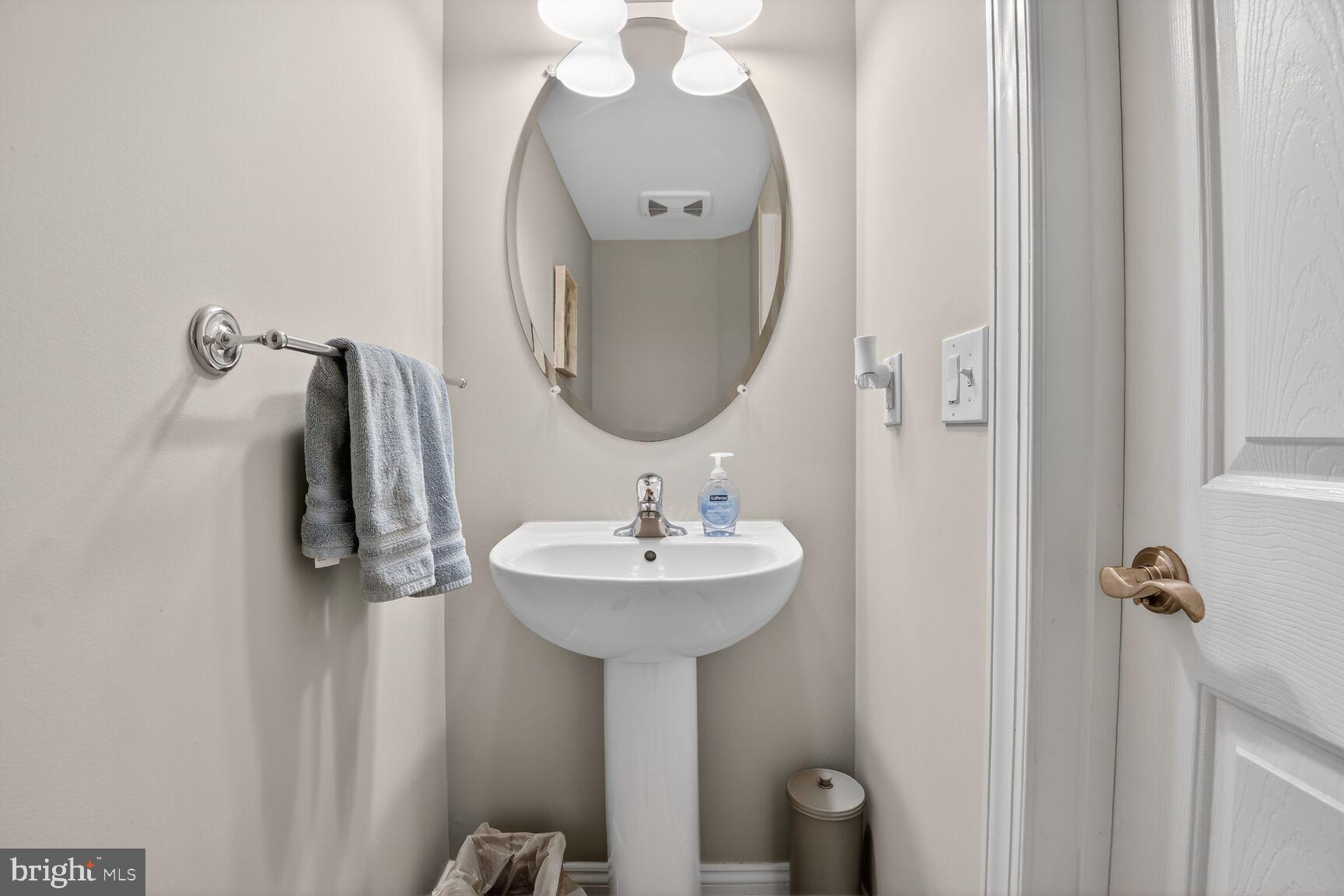 8808 Talbert Road Lorton, VA 22079 - Photo 44 of 52 a bathroom with a sink a mirror and shower