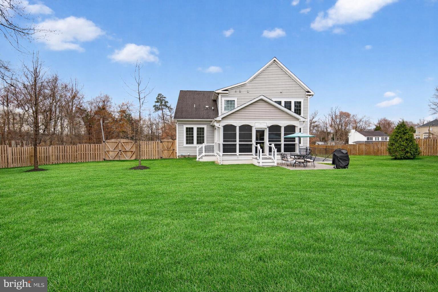 8808 Talbert Road Lorton, VA 22079 - Photo 45 of 52 a front view of a house with a yard table and trees