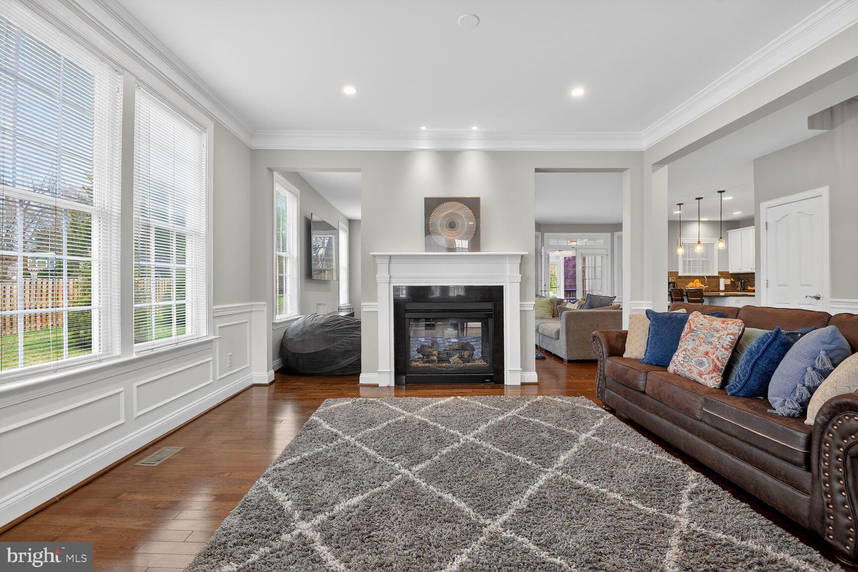 8808 Talbert Road Lorton, VA 22079 - Photo 6 of 52 a living room with furniture and a fireplace