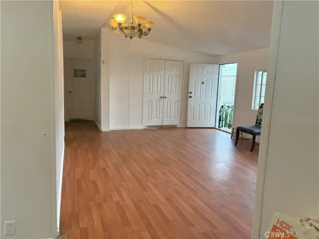 a view of a livingroom with a hardwood floor and a ceiling fan