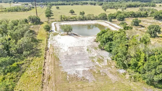 a view of a swimming pool with a yard