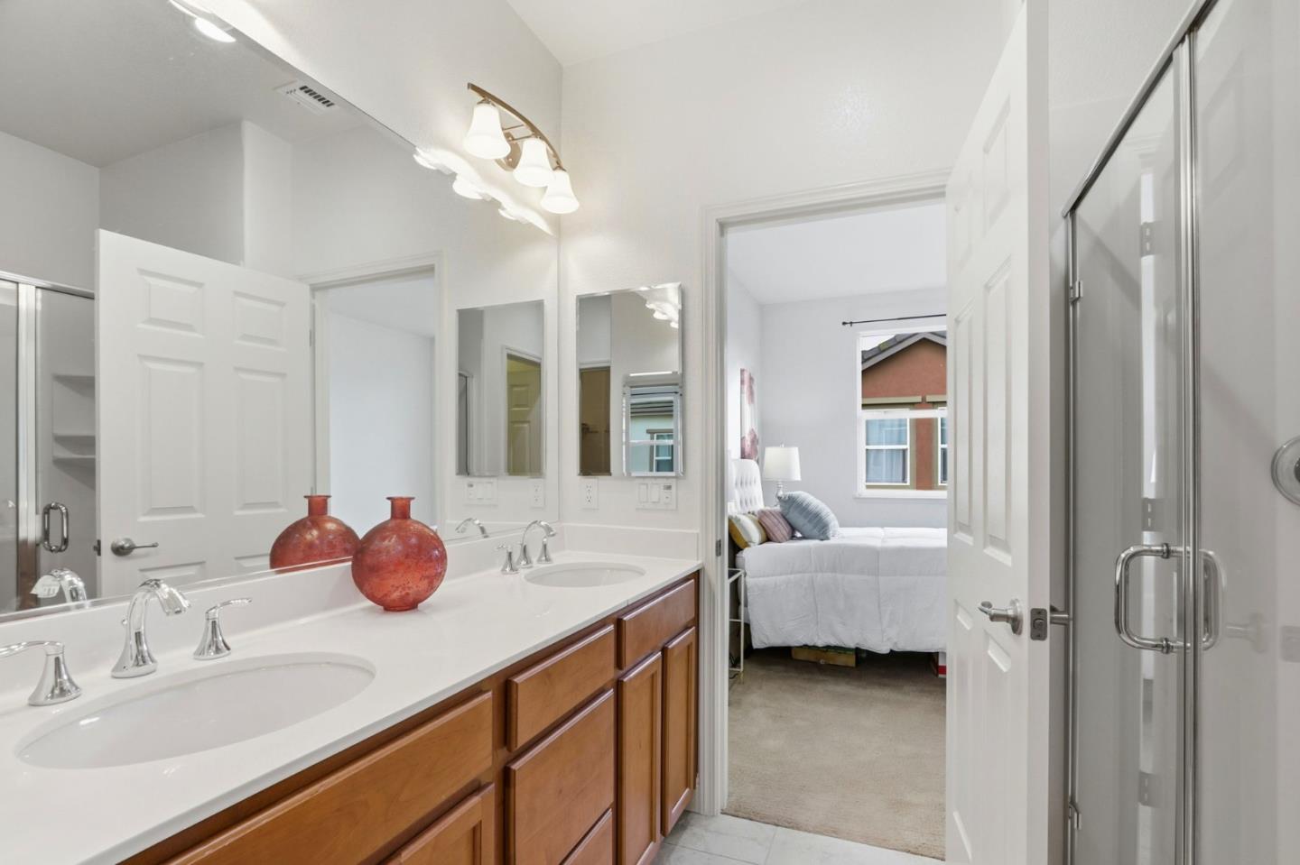 1550 Bleecker Street Milpitas, CA 95035 - Photo 19 of 35 a en suite bathroom with a granite countertop sink and a mirror