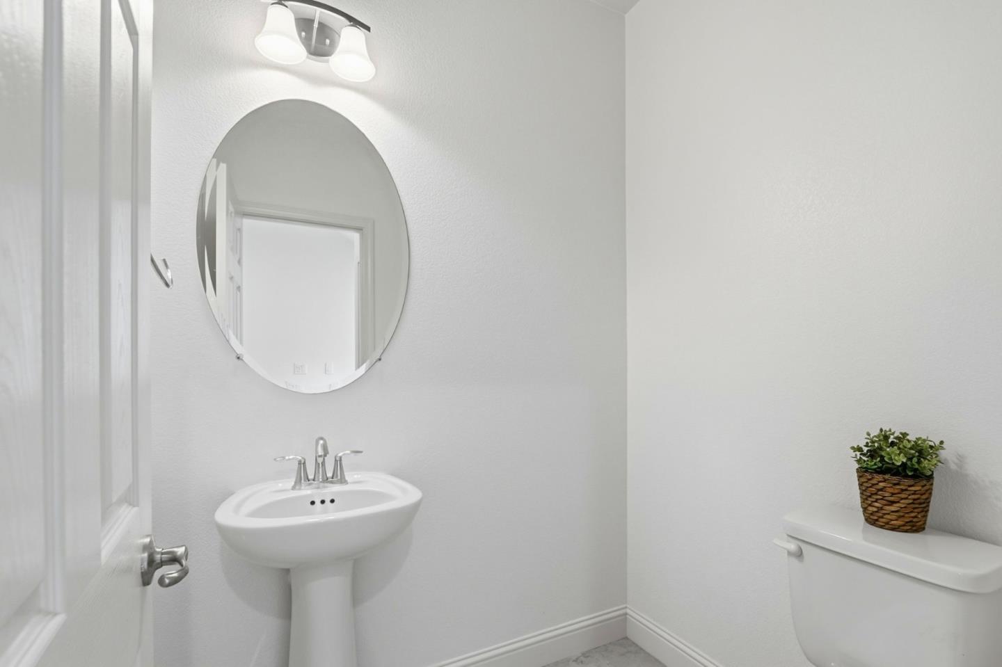 1550 Bleecker Street Milpitas, CA 95035 - Photo 22 of 35 a bathroom with a sink a mirror and toilet