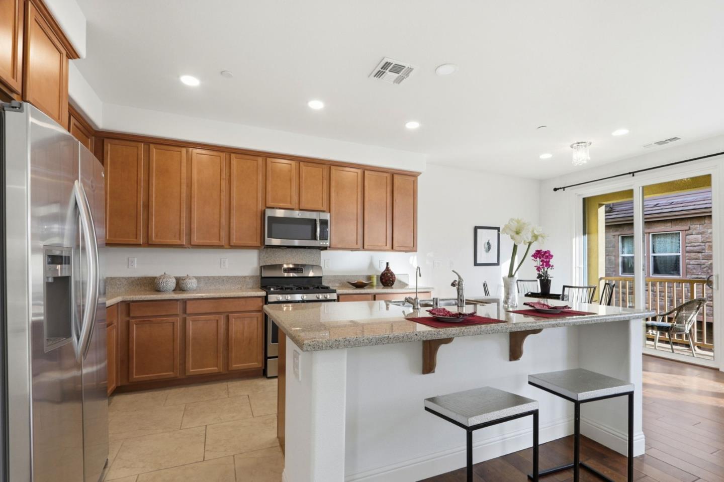 1550 Bleecker Street Milpitas, CA 95035 - Photo 4 of 35 a kitchen with a sink and cabinets