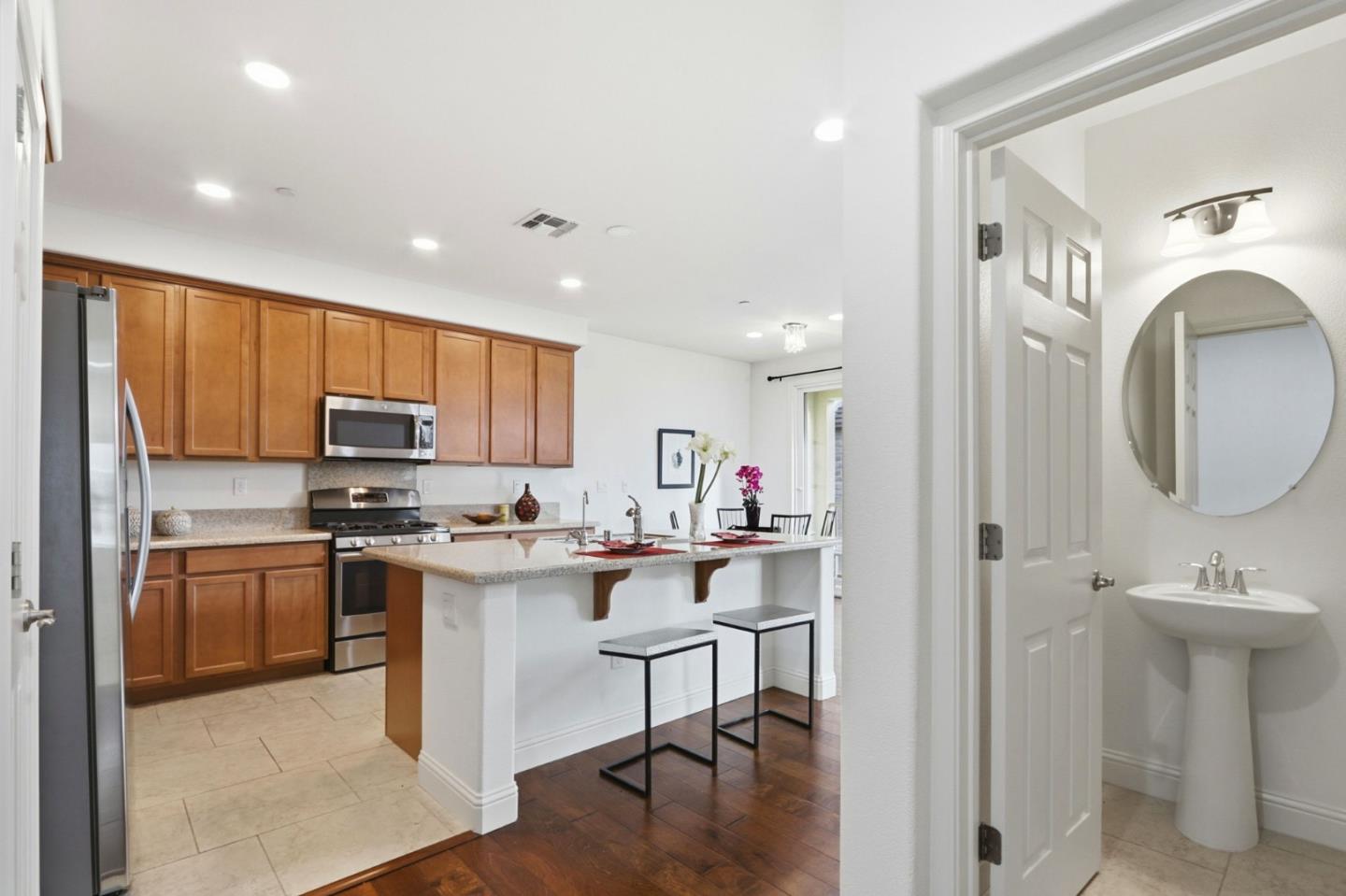 1550 Bleecker Street Milpitas, CA 95035 - Photo 6 of 35 a kitchen with kitchen island a sink stove and refrigerator