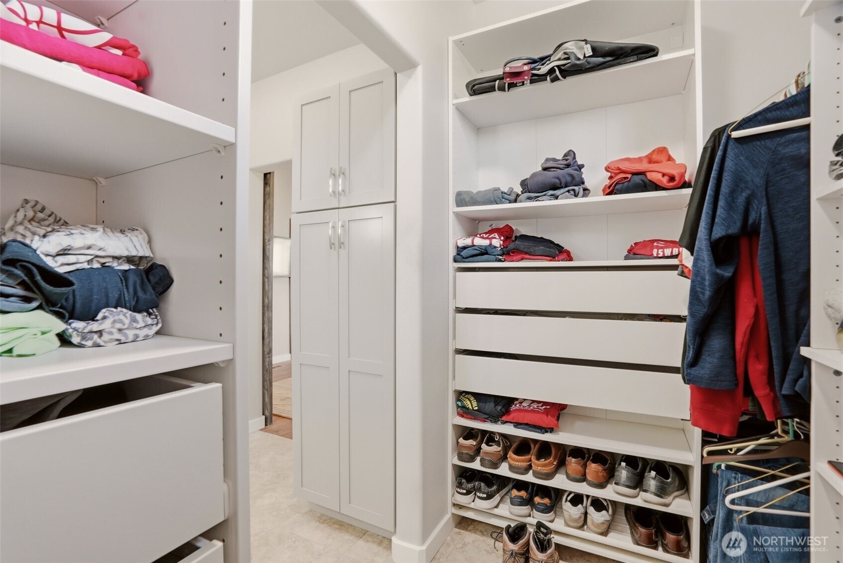 12119 South Spotted Road Cheney, WA 99004 - Photo 17 of 40 a view of walk in closet with clothes and shoes