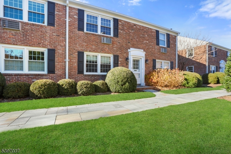 68-86 New England Avenue, Unit 18 Summit, NJ 07901 - Photo 1 of 14 a view of a house with a garden and plants