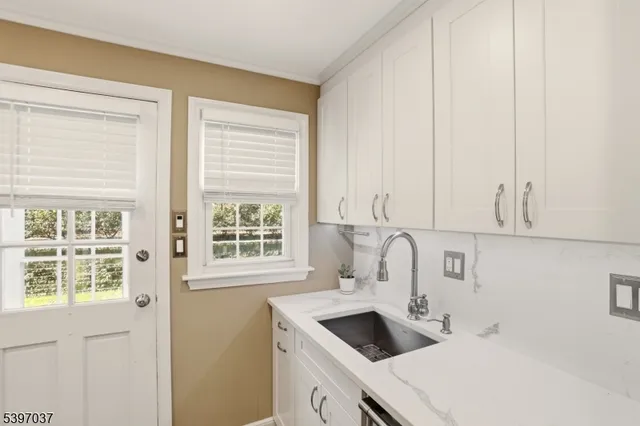 a kitchen with a sink and a window