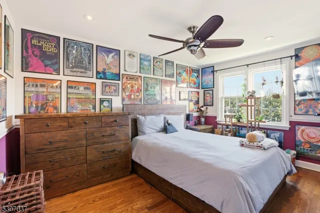 a bedroom with a large bed and a large window