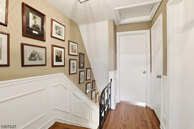 a view of an entryway with wooden floor