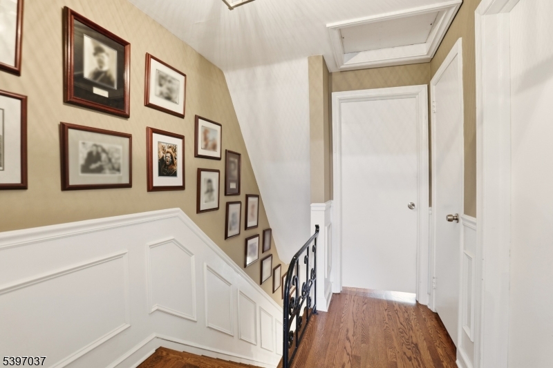 68-86 New England Avenue, Unit 18 Summit, NJ 07901 - Photo 9 of 14 a view of an entryway with wooden floor
