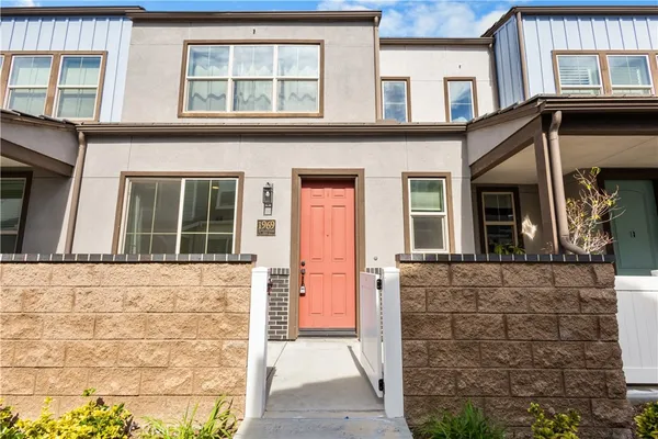 front view of a brick house with a large windows