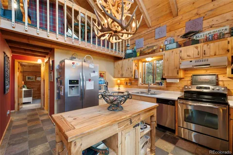 a kitchen with a stove and cabinets