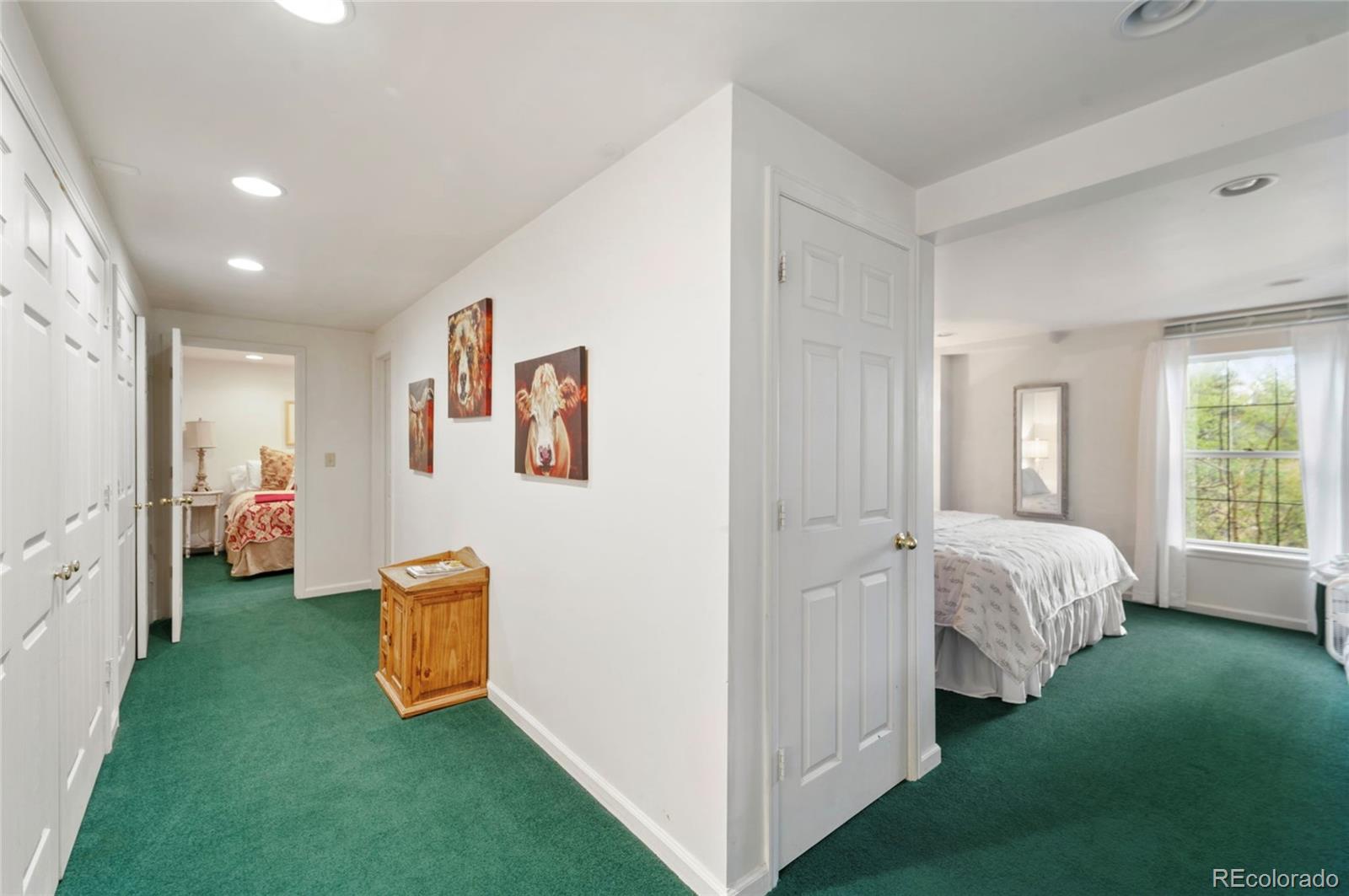 2578 Redhill Road Fairplay, CO 80440 - Photo 27 of 48 a bed room with a bed and three large window