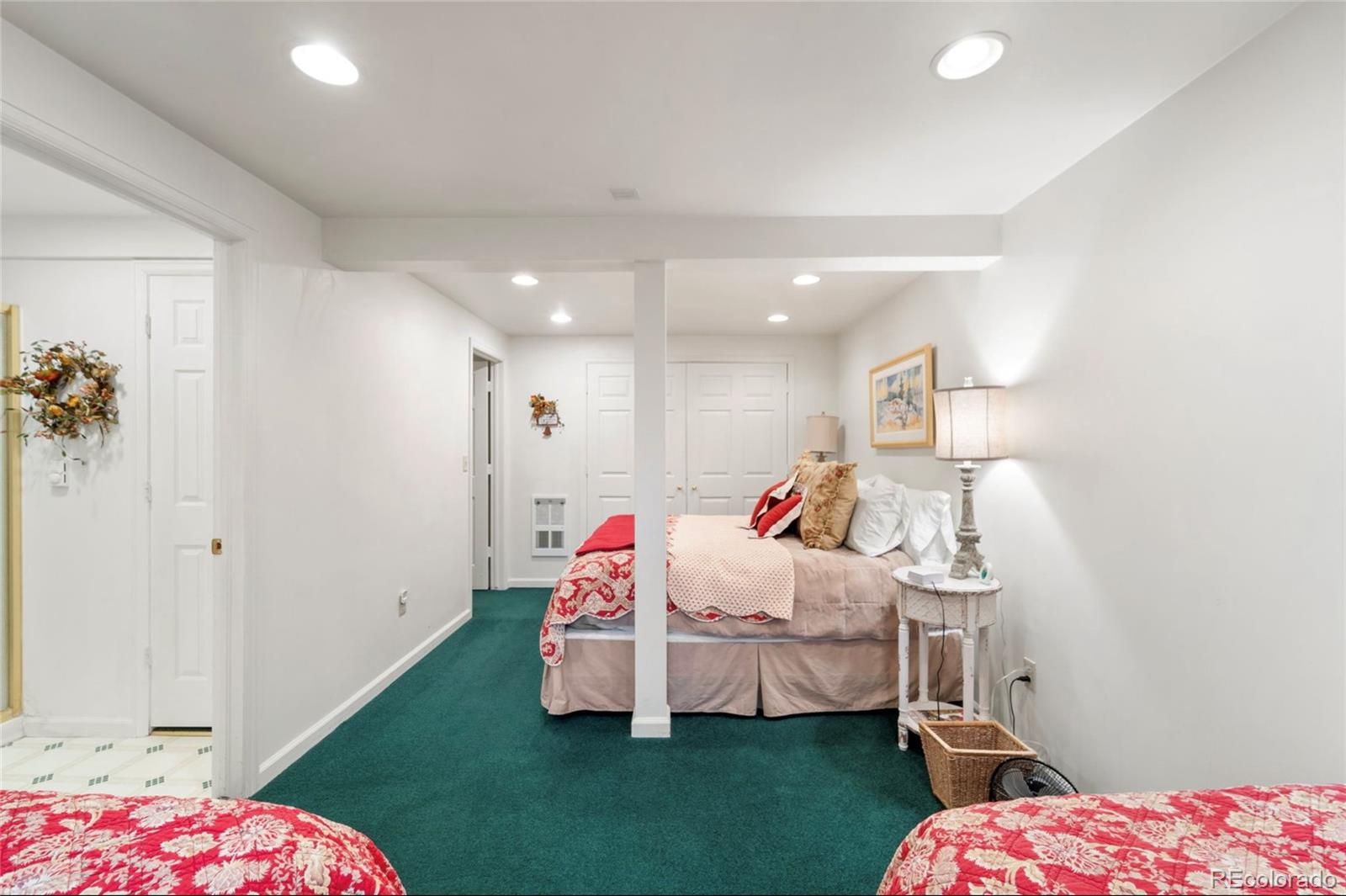 2578 Redhill Road Fairplay, CO 80440 - Photo 29 of 48 a bedroom with a bed and a chandelier