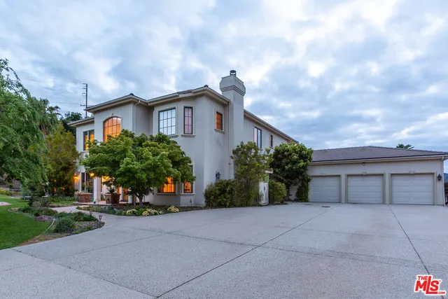 a view of a house with a street