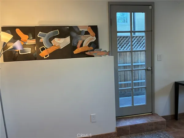 wooden floor with some white walls