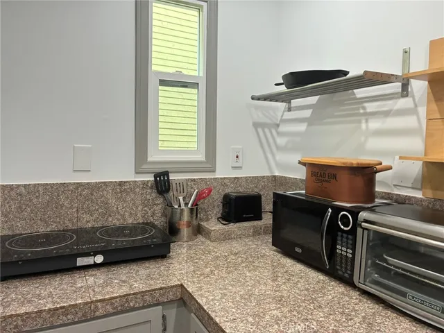 a living room with furniture and a gate