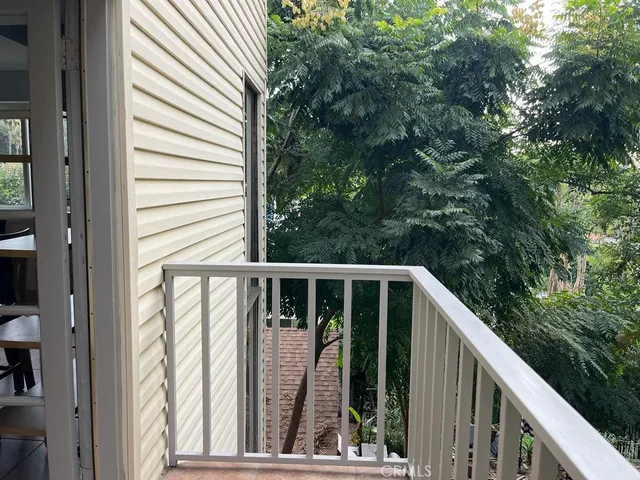 a view of balcony with furniture