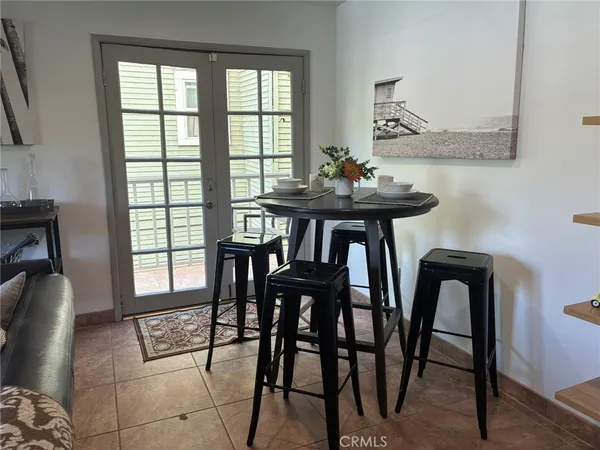 a view of a dining room with furniture and window