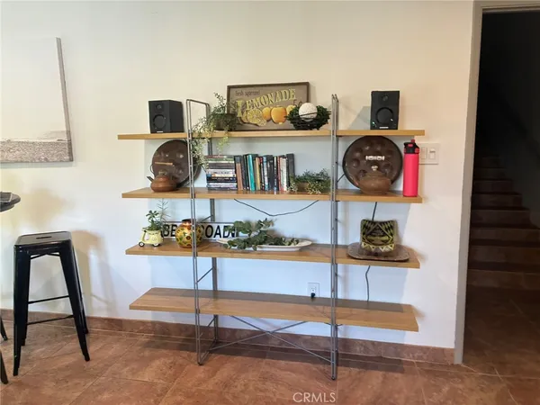 a view of living room with furniture and rug