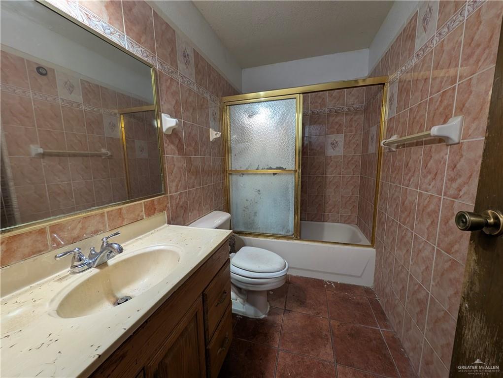 2012 Spring Glenn Avenue Mission, TX 78572 - Photo 12 of 20 a bathroom with a sink toilet and shower
