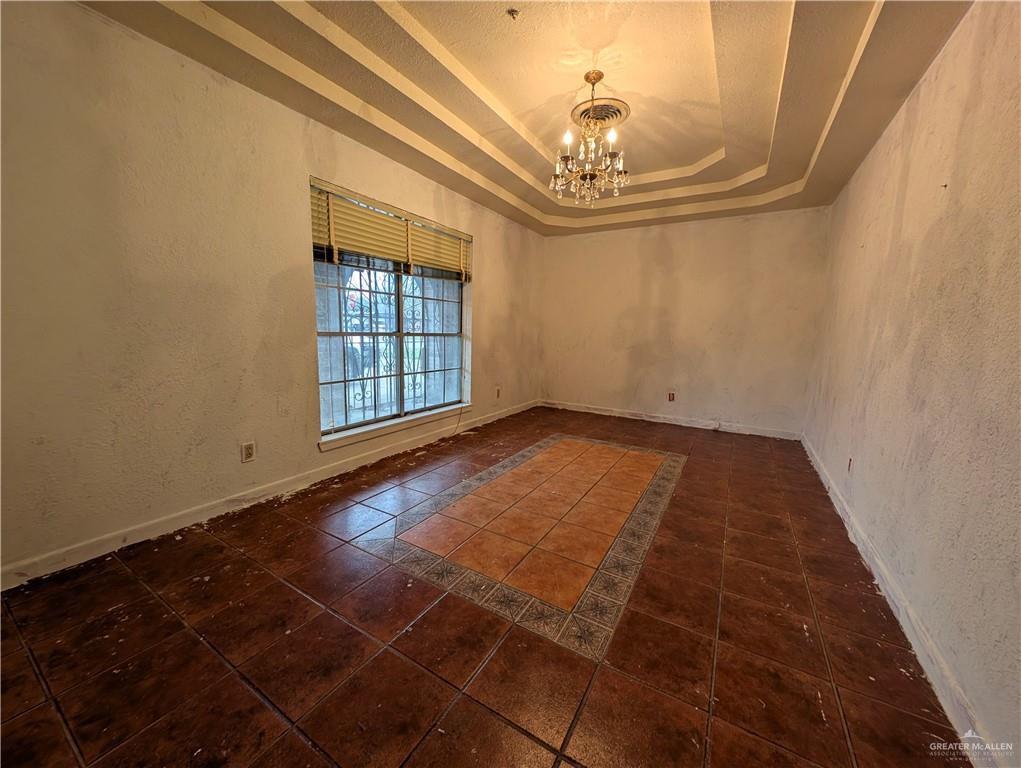 2012 Spring Glenn Avenue Mission, TX 78572 - Photo 3 of 20 a view of an empty room with a chandelier