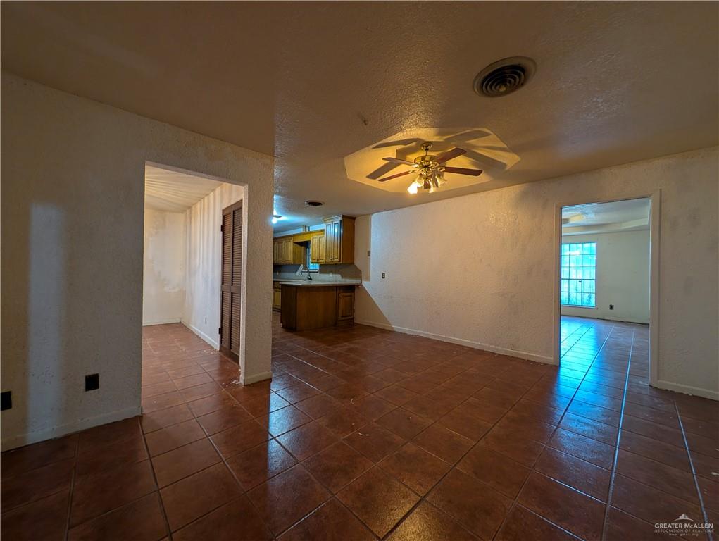 2012 Spring Glenn Avenue Mission, TX 78572 - Photo 4 of 20 a view of livingroom with hardwood floor and a ceiling fan