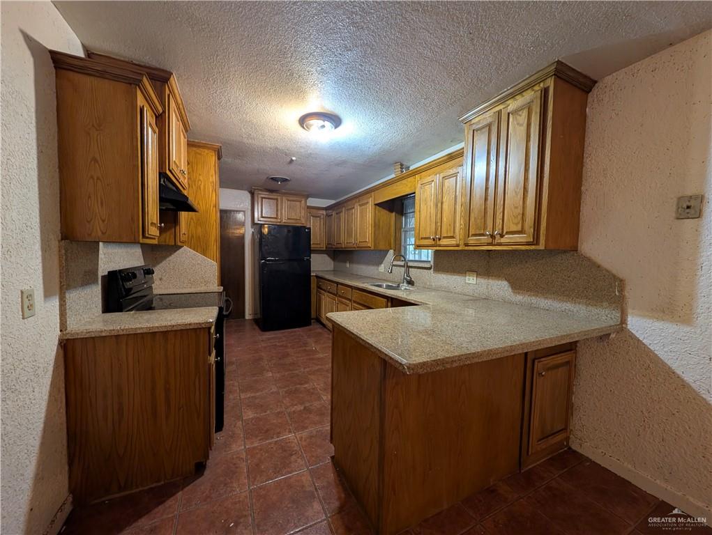 2012 Spring Glenn Avenue Mission, TX 78572 - Photo 8 of 20 a kitchen with stainless steel appliances granite countertop a sink stove and refrigerator