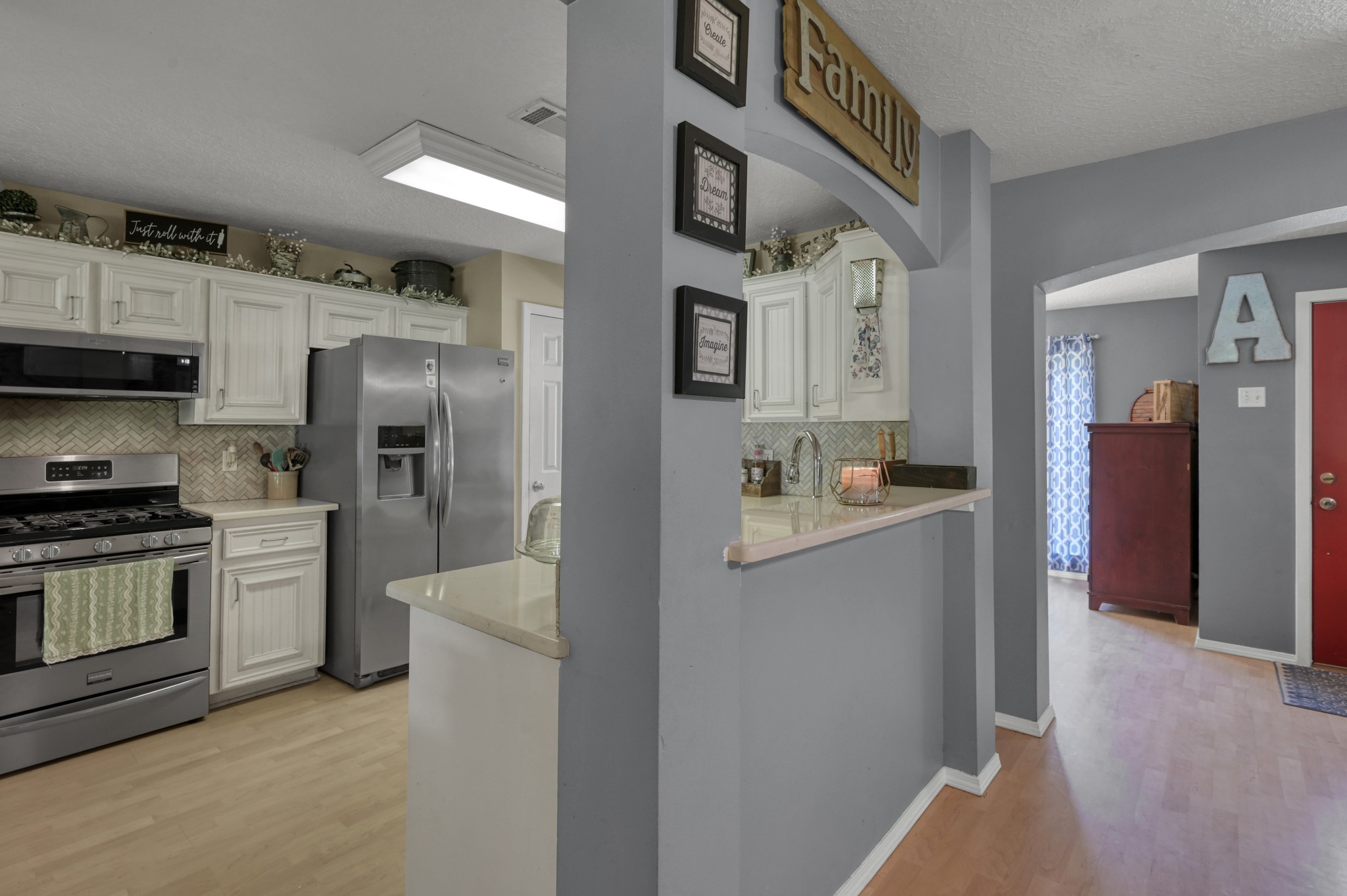 14909 Pine Tree Road Montgomery, TX 77356 - Photo 11 of 49 The kitchen is just off from the living room, making the space perfect for entertaining