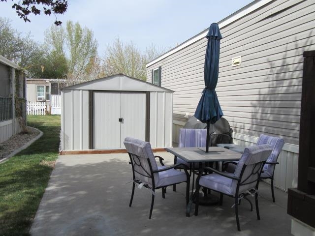 3251 E Road, Unit 99 Clifton, CO 81520 - Photo 24 of 25 a view of a house with backyard and sitting area