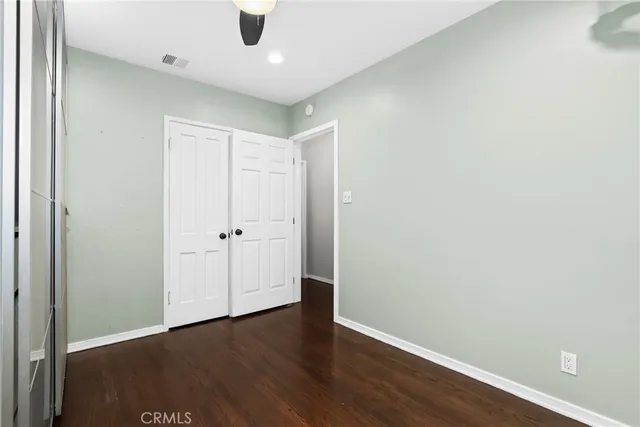 an empty room with wooden floor