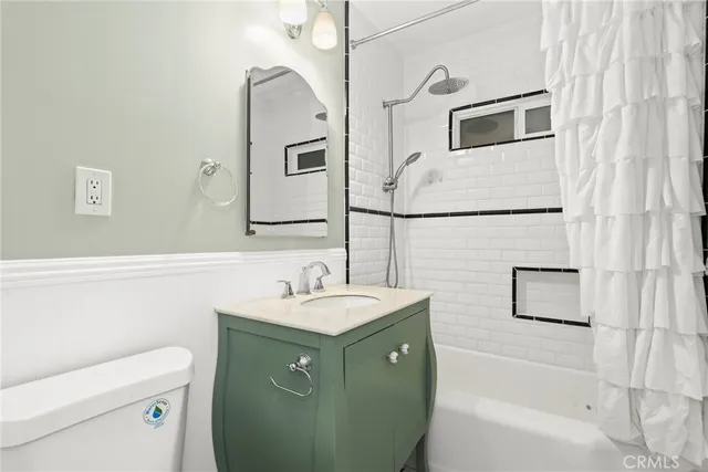 a bathroom with a sink toilet and tub