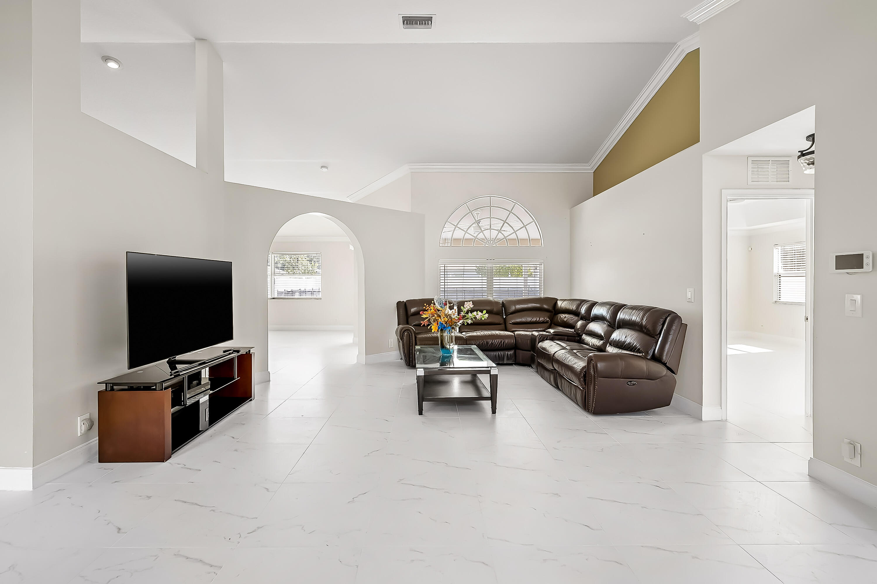 2962 Southwest Coastal Terrace Port St. Lucie, FL 34953 - Photo 15 of 59 a living room with furniture and a flat screen tv