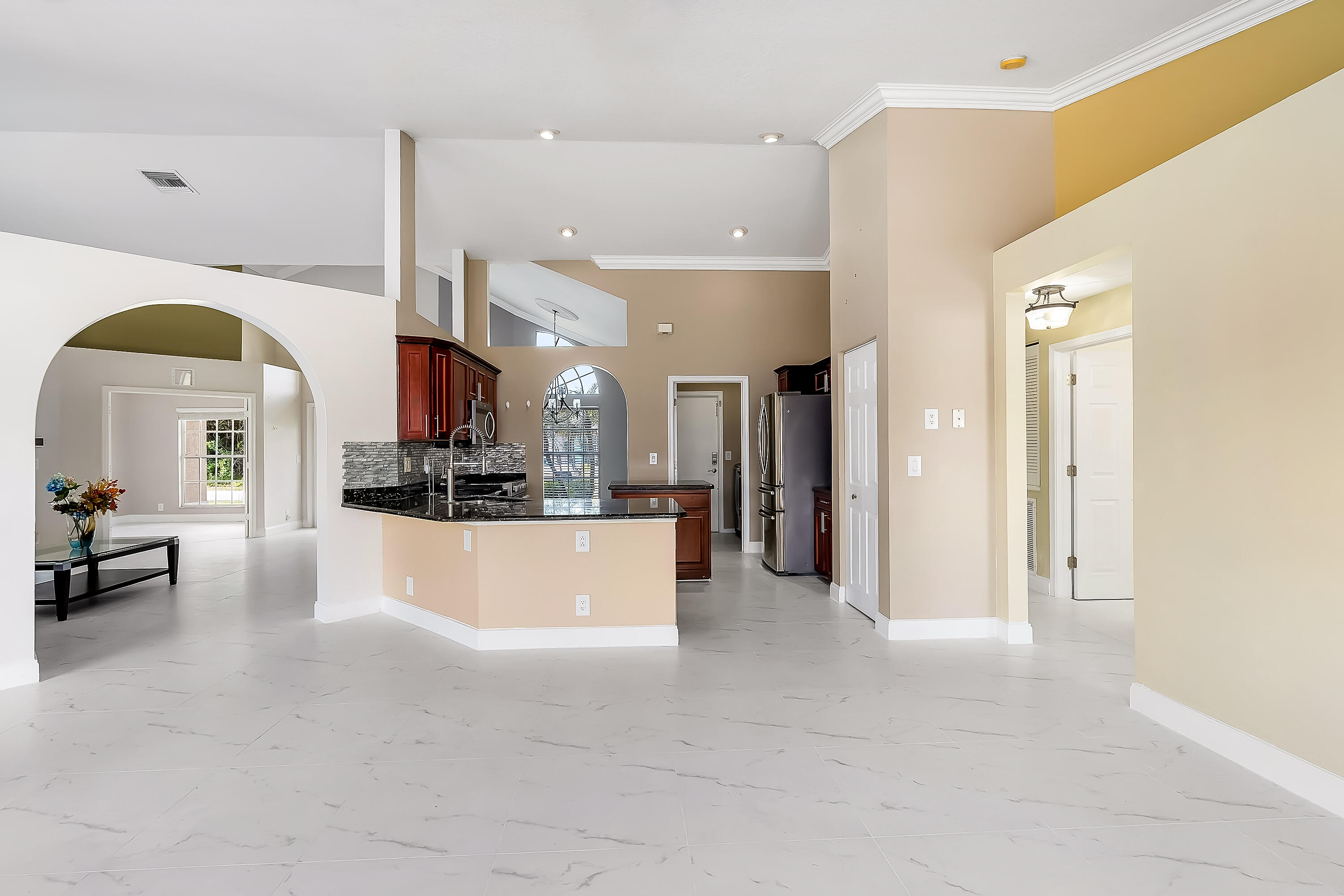 2962 Southwest Coastal Terrace Port St. Lucie, FL 34953 - Photo 26 of 59 a view of a living room and a kitchen