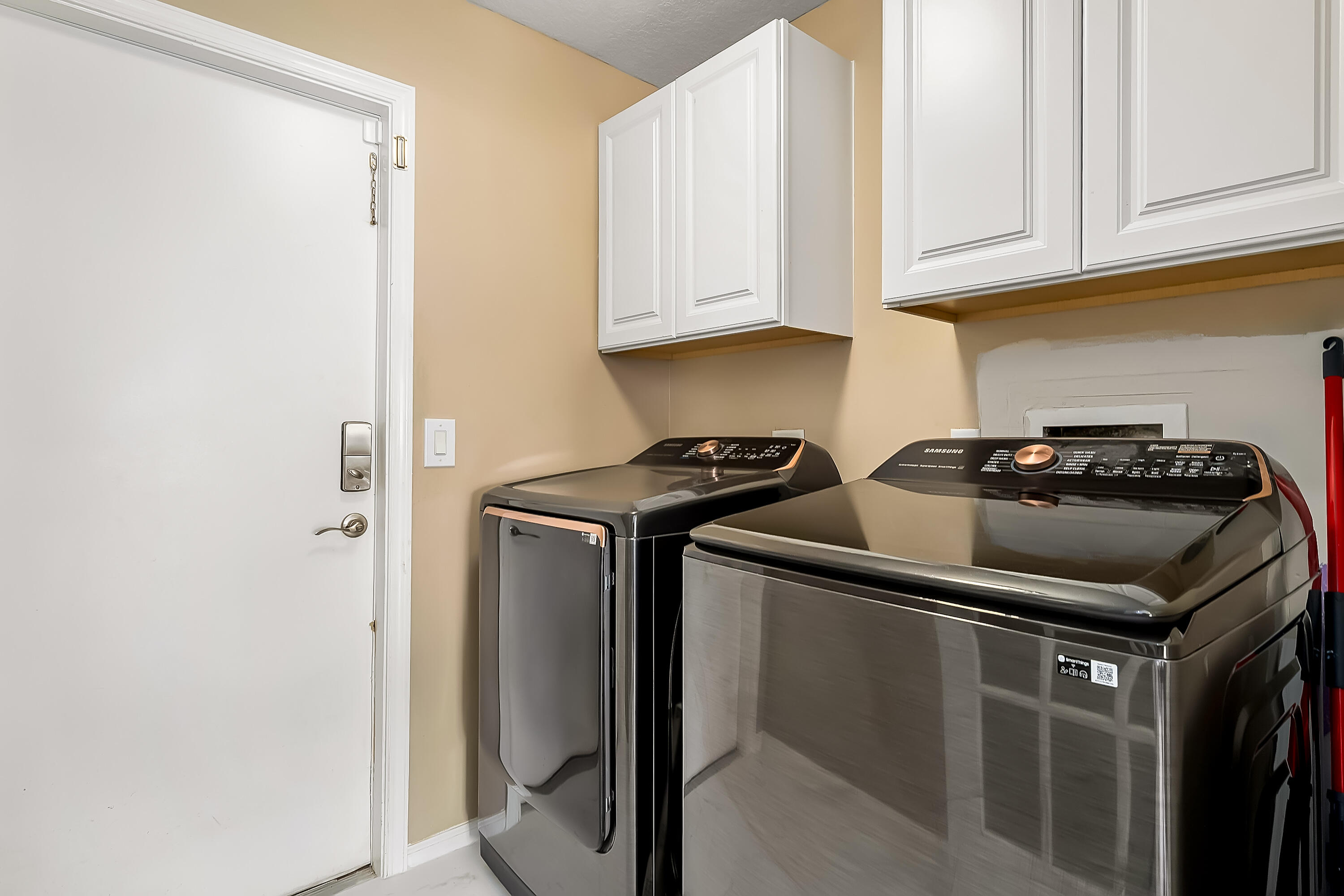 2962 Southwest Coastal Terrace Port St. Lucie, FL 34953 - Photo 33 of 59 a close view of storage and utility room with washer and dryer