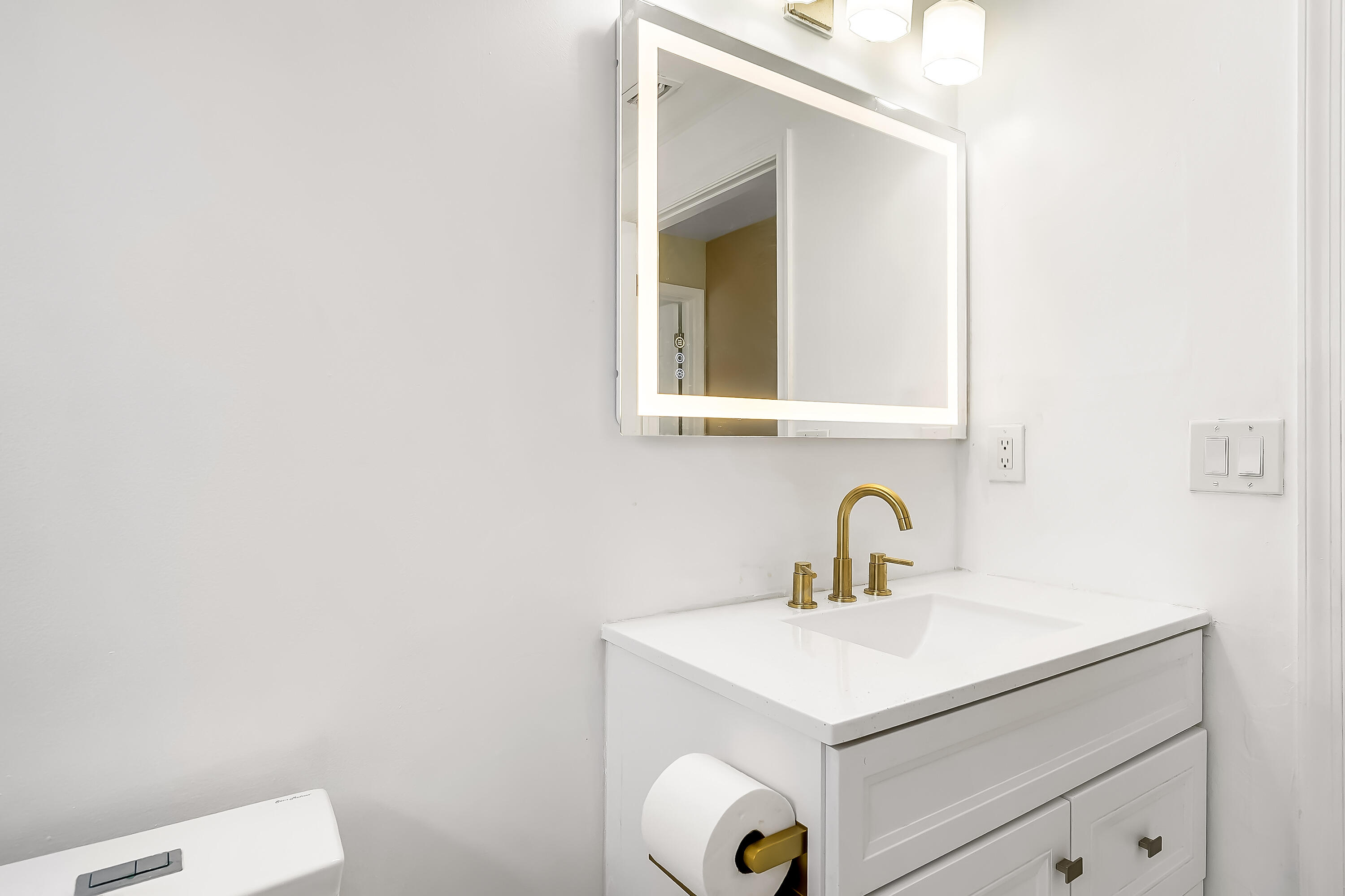 2962 Southwest Coastal Terrace Port St. Lucie, FL 34953 - Photo 39 of 59 a bathroom with a sink and a toilet