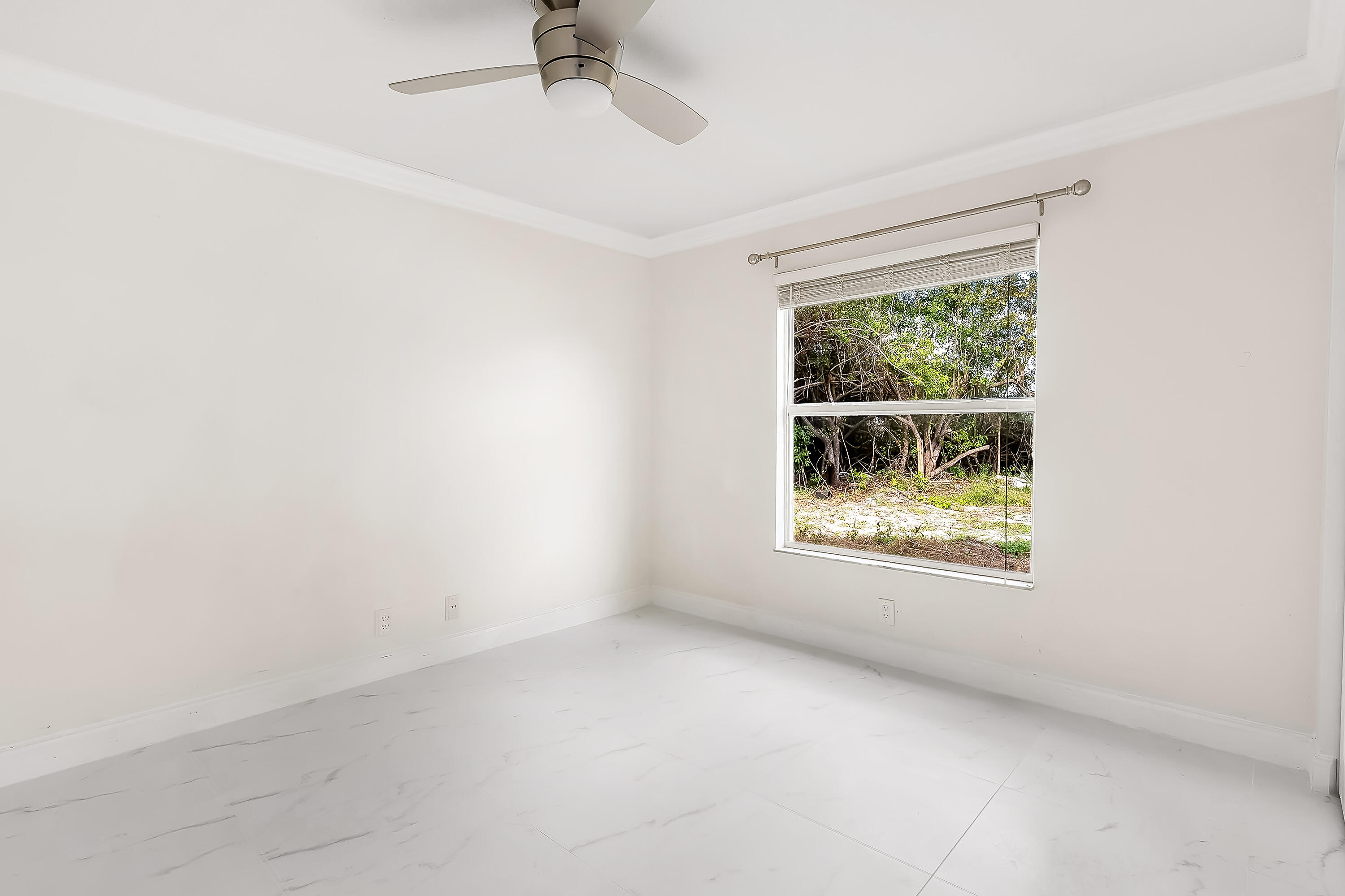 2962 Southwest Coastal Terrace Port St. Lucie, FL 34953 - Photo 41 of 59 an empty room with a window