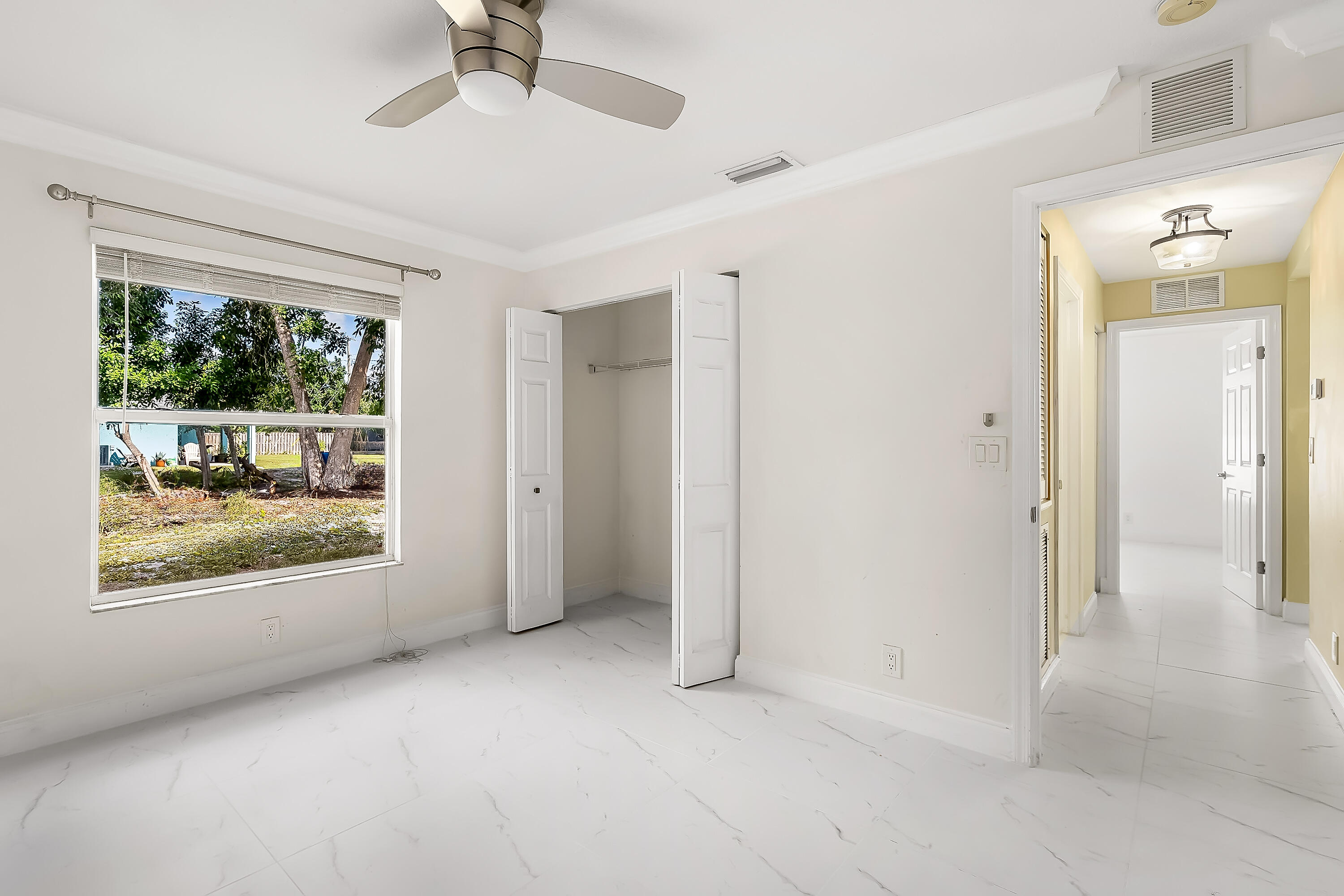 2962 Southwest Coastal Terrace Port St. Lucie, FL 34953 - Photo 42 of 59 a view of an empty room with a window
