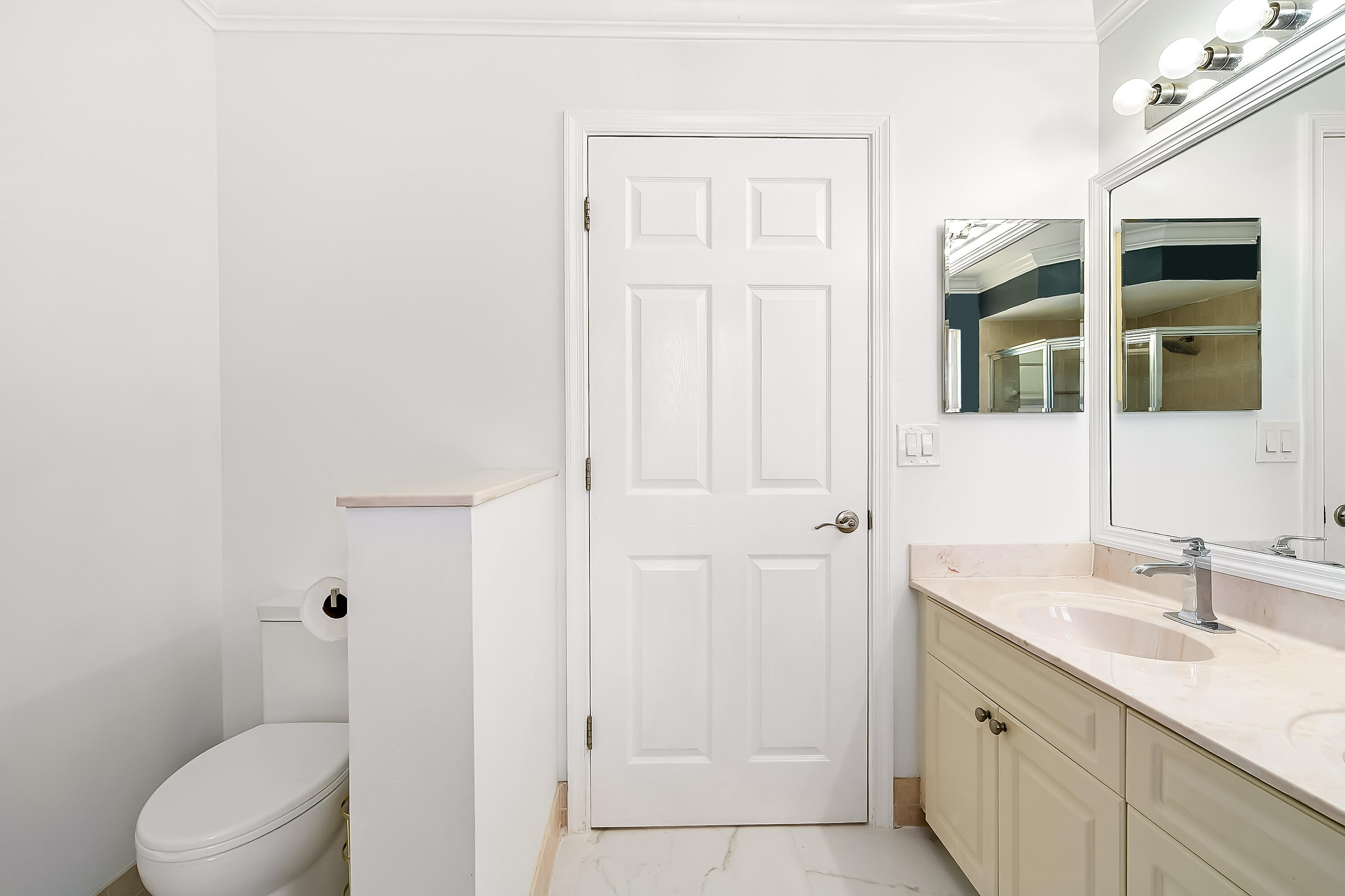 2962 Southwest Coastal Terrace Port St. Lucie, FL 34953 - Photo 50 of 59 a bathroom with a granite countertop sink a mirror and a toilet