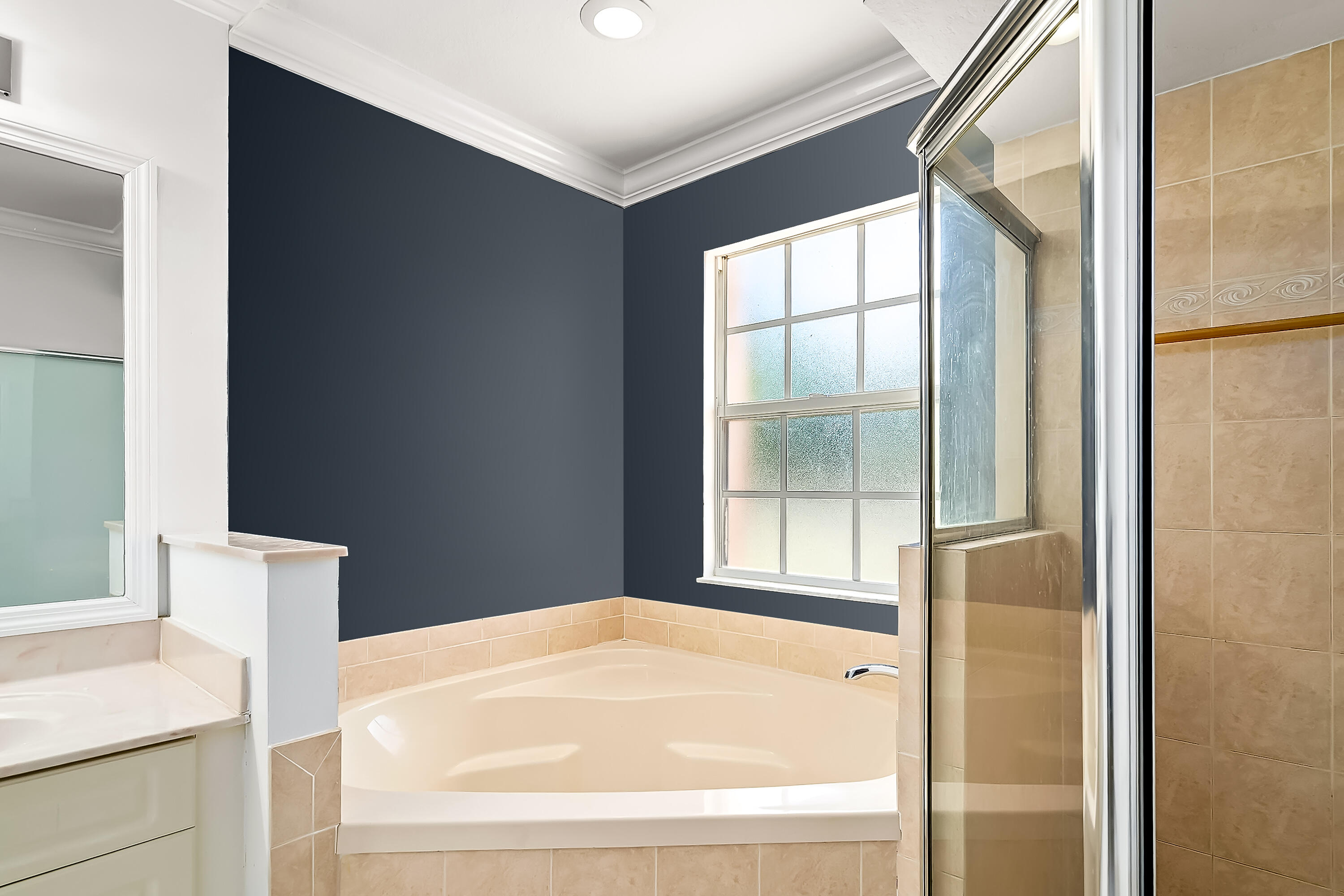 2962 Southwest Coastal Terrace Port St. Lucie, FL 34953 - Photo 51 of 59 a bathroom with a bathtub and next to a window